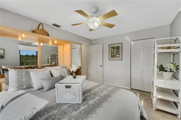 Bedroom featuring a closet, ceiling fan, and hardwood / wood-style floors