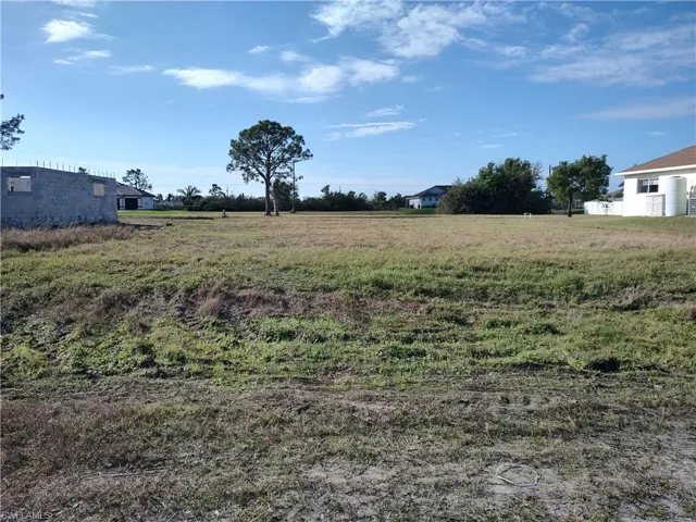 View of yard with a rural view