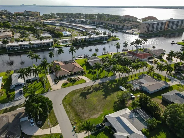 Aerial view of residential area featuring a large body of water