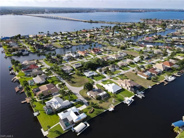 Aerial overview of property's location with nearby suburban area, a nearby body of water, and a notable bridge