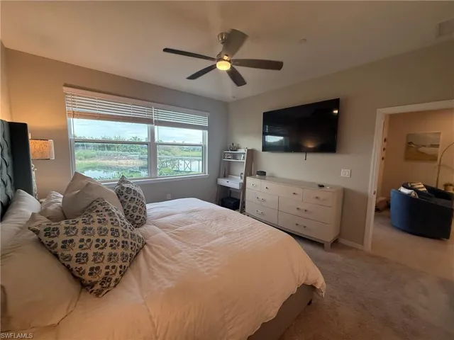 Recessed lighting, ceiling fan, large window with blinds, and light-colored wall paint