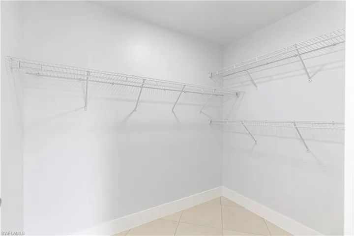 Spacious closet featuring light tile patterned floors