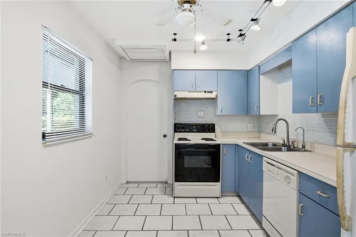 The front residence offers 1,083 sq ft with 2 bedrooms, 2 bathrooms, attached 1-car garage, and TILE FLOORING throughout the main living areas.