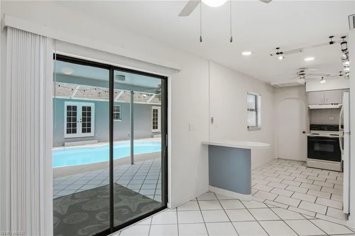 FRONT HOUSE DINING + SLIDERS TO COURTYARD POOL/POOL DECK
