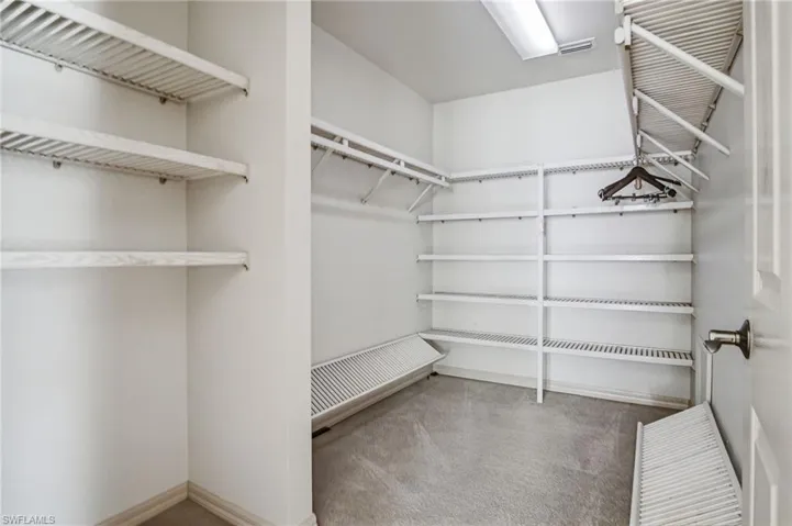 REAR HOUSE: SPACIOUS WALK-IN CLOSET IN PRIMARY SUITE