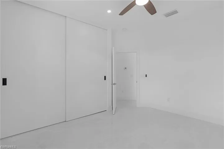 Unfurnished bedroom with a closet, a ceiling fan, and recessed lighting