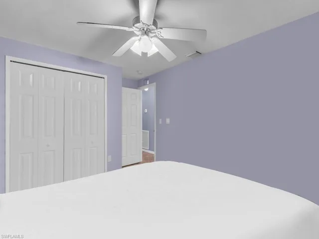 Unfurnished bedroom featuring a closet and ceiling fan