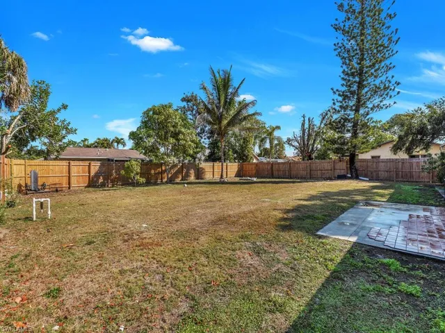 Fenced backyard with a patio area