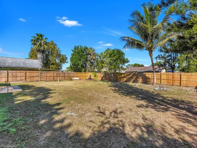 View of fenced backyard