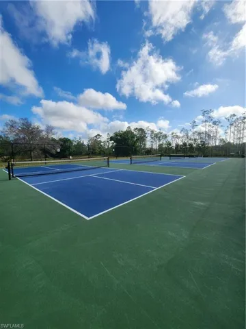View of tennis court with community basketball court