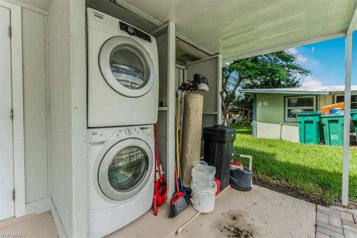 Laundry area with stacked washer / drying machine
