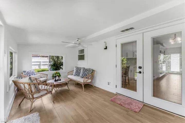 Sunroom featuring french doors