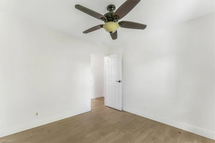 Unfurnished room with light wood-style flooring and a ceiling fan