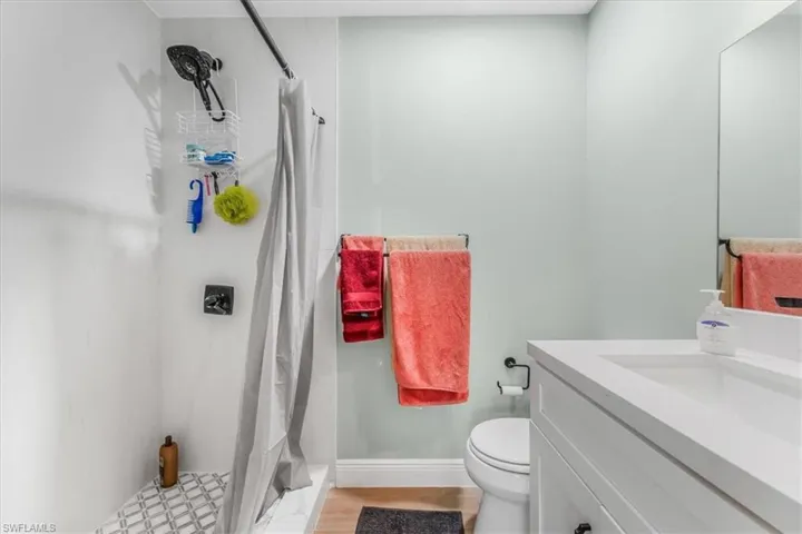 Bathroom with vanity and a stall shower