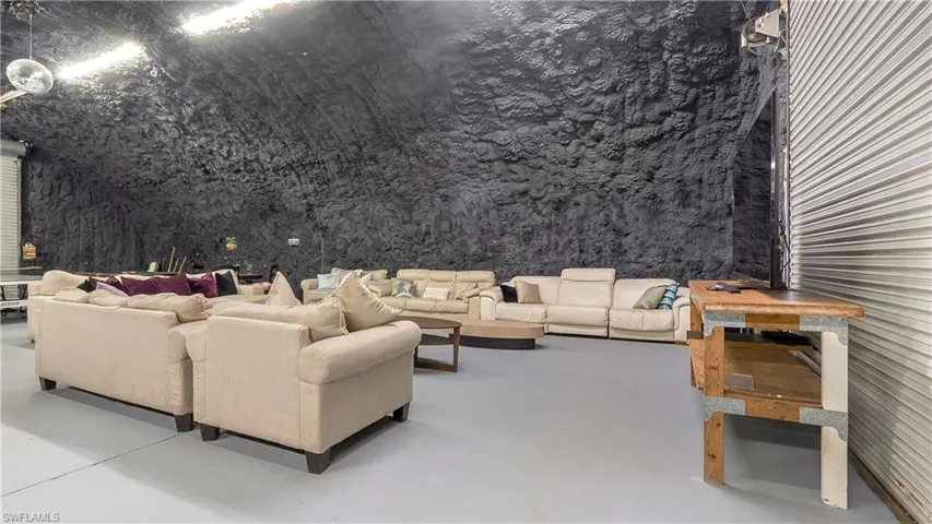 Living area featuring finished concrete flooring