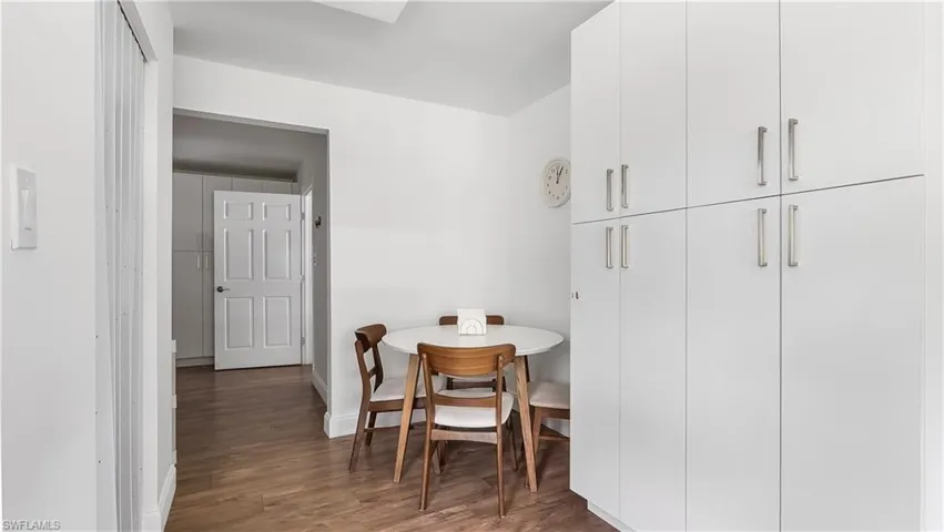Dining room with baseboards and wood finished floors