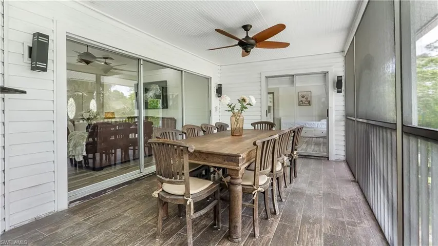 Sunroom / solarium featuring a ceiling fan