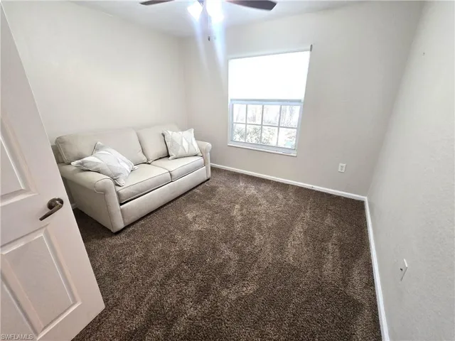 2nd bedroom, carpet, fan w/light. Impact Window.