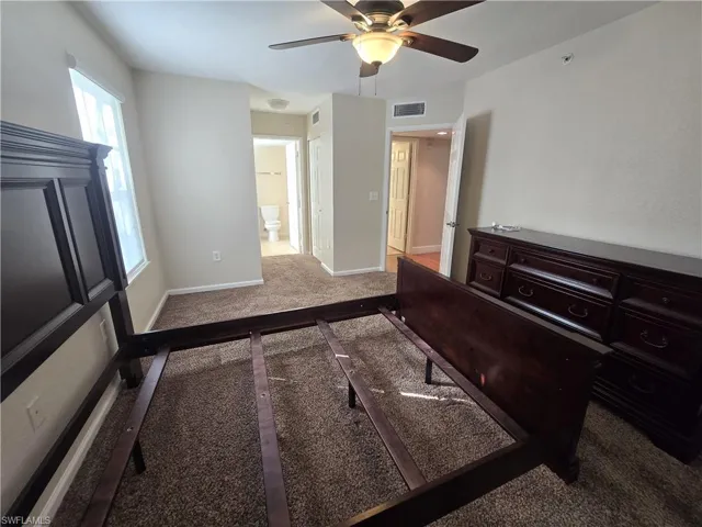 Lush carpet, fan with light fixture, 2 closets in hall to bathroom.