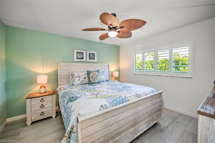 Bedroom featuring ceiling fan and light hardwood / wood-style floors