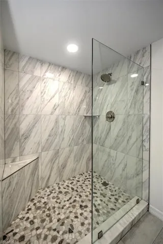 Bathroom featuring tiled shower