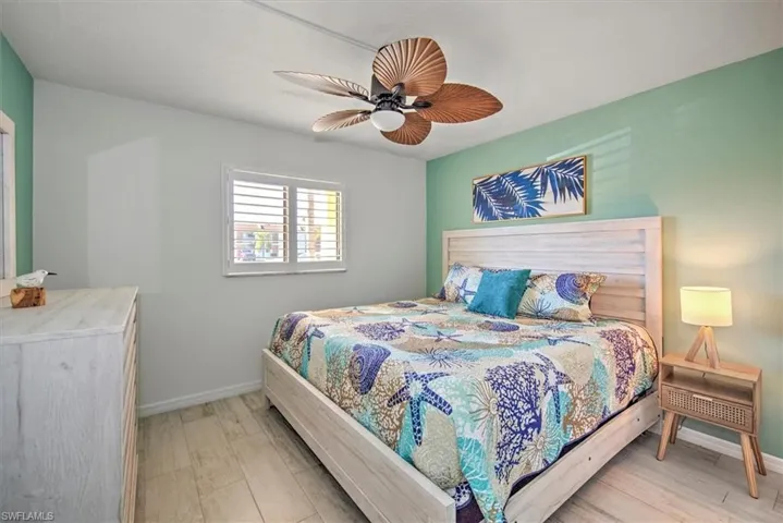 Bedroom featuring ceiling fan and light hardwood / wood-style floors