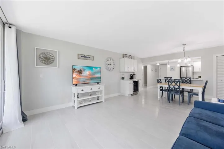 Living room with wine cooler and a chandelier