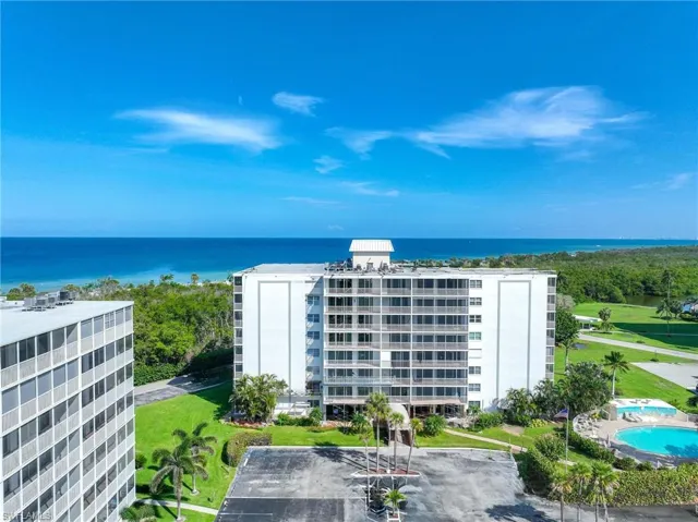 View of apartment building / complex featuring a water view
