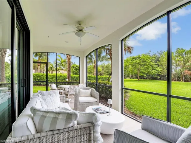 Sunroom with an outdoor living space and a ceiling fan