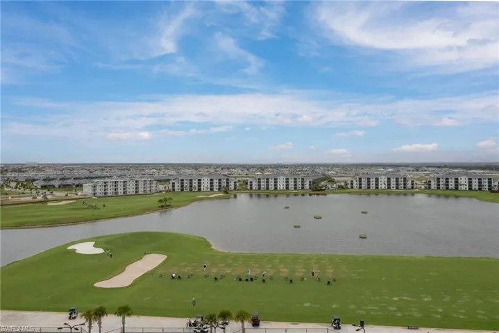 Drone / aerial view of a golf course and a lake