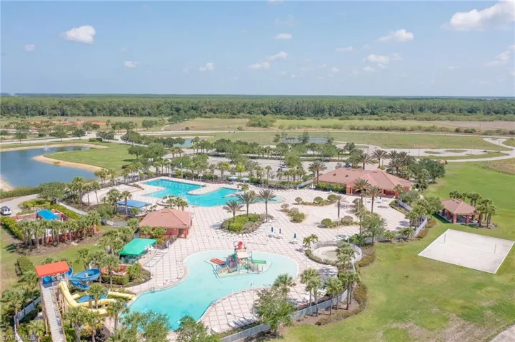 Aerial view of a pool area at Water Park with slide and play area