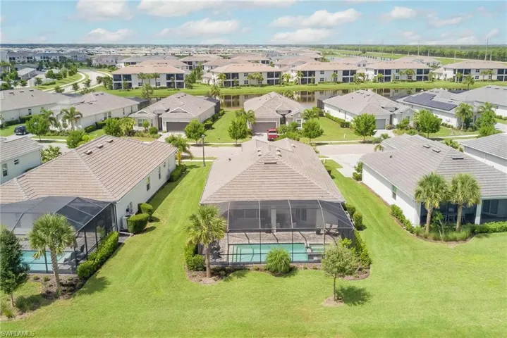 Aerial perspective of rear of home  featuring a pool & spa area