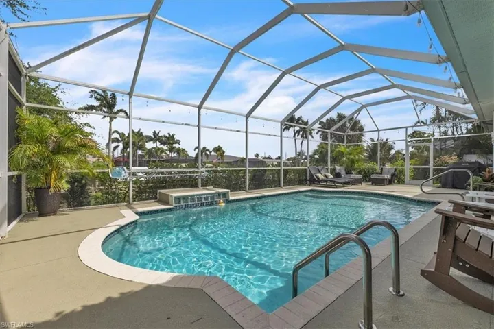 Screened enclosed lanai  for pool area.