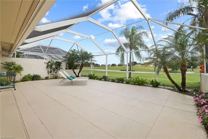 View of patio featuring a lanai