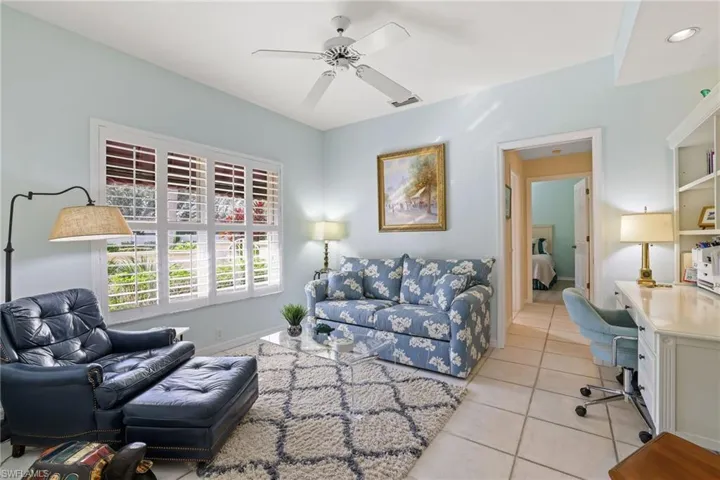 Tiled living room with ceiling fan