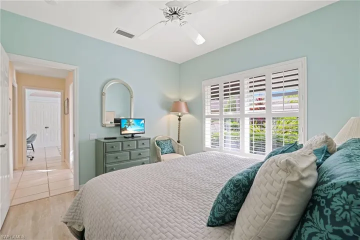 Bedroom featuring ceiling fan and light wood-type flooring