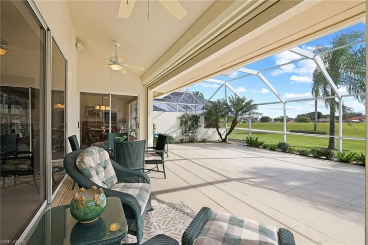 View of patio / terrace featuring a lanai and ceiling fan