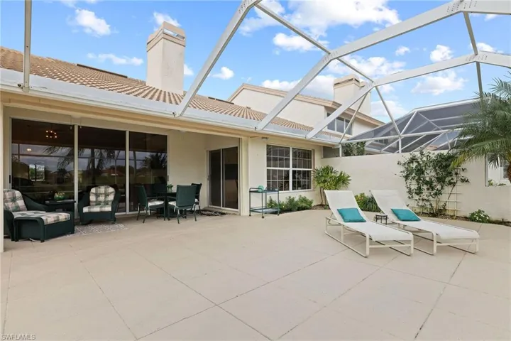 View of patio / terrace featuring glass enclosure