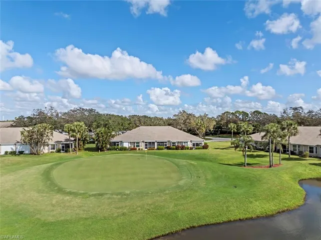 View of property's community with a yard