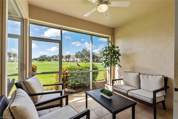 Sunroom featuring ceiling fan