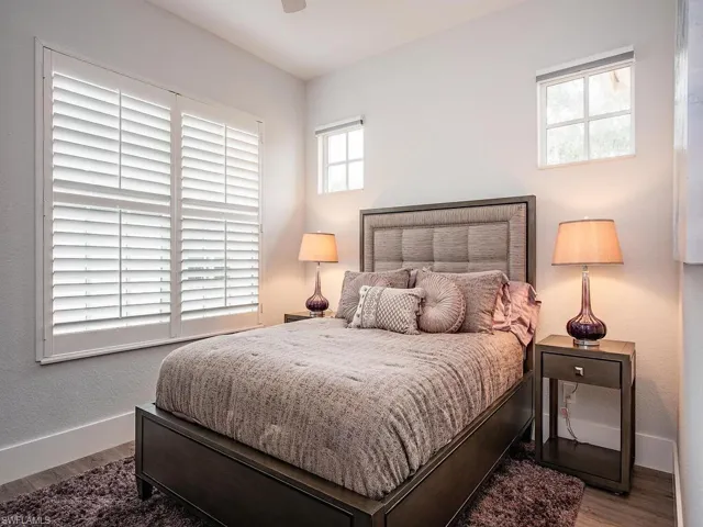 Bedroom featuring ceiling fan and wood-type flooring