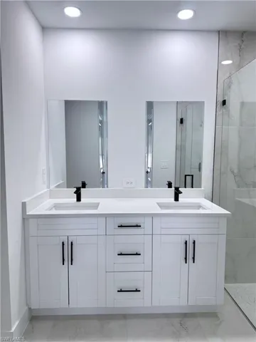 Unfurnished room featuring light marble finish floors and recessed lighting
