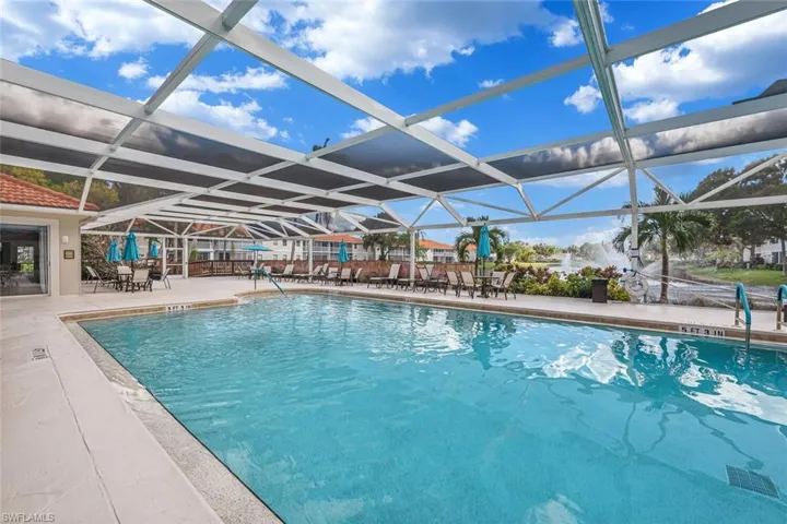 View of community pool with a patio and a lanai