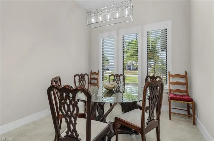 Dining space featuring healthy amount of natural light and light tile patterned floors
