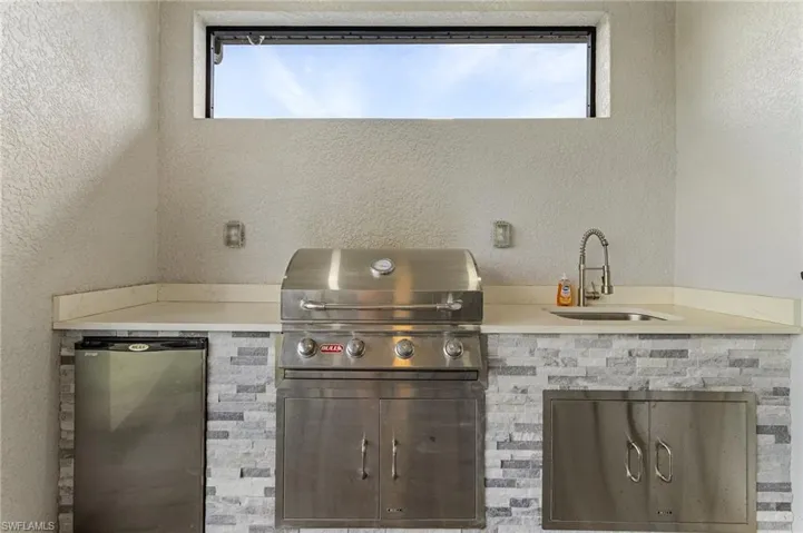 View of patio with area for grilling