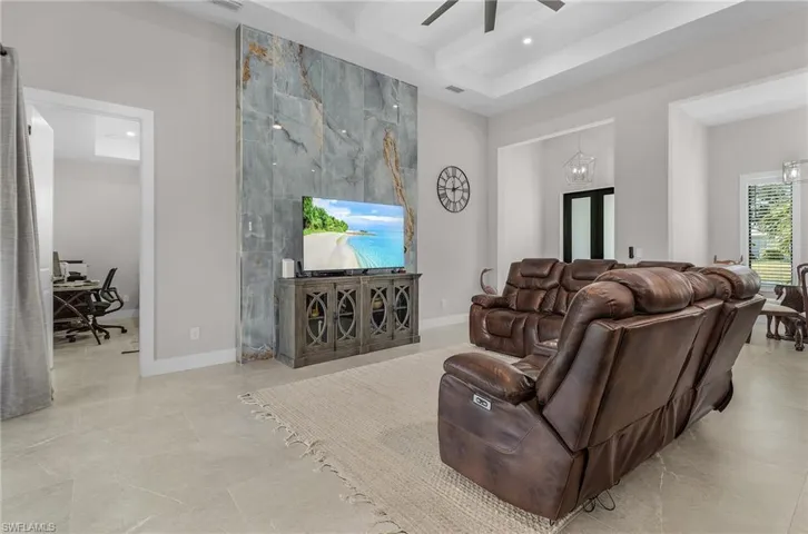 Living area featuring an office area, a ceiling fan, beamed ceiling, and recessed lighting