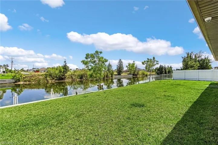 View of yard with a water view