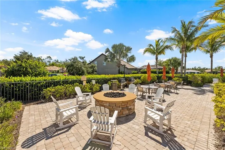 View of natural gas operated grills and outdoor fire pit in common use area.