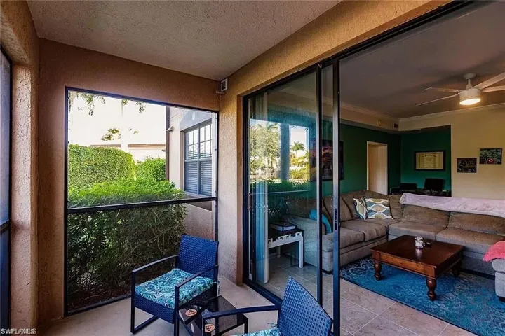 Sunroom / solarium with ceiling fan and an outdoor hangout area