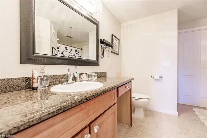 Bathroom featuring vanity and tile patterned floors